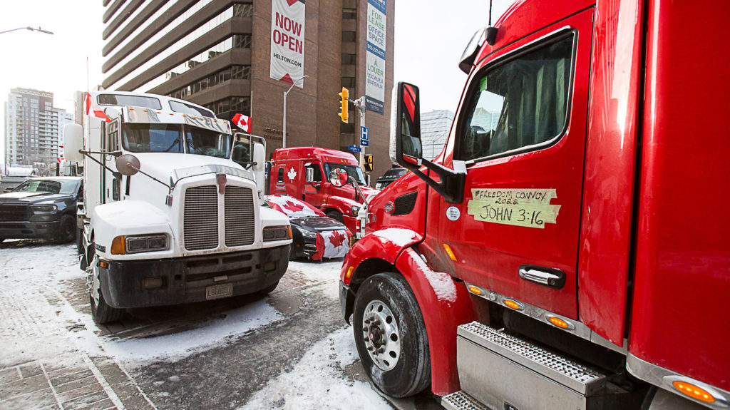 Trucks blocking Lyon Street at Queen in the “red zone” on February 12. Not “now open”. (Brett Delmage/The BUZZ)