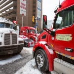 Trucks blocking Lyon Street at Queen in the “red zone” on February 12. Not “now open”. (Brett Delmage/The BUZZ)