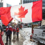 “Freedom” convoyers occupying downtown Ottawa on February 12, 2022. (Brett Delmage/The BUZZ)
