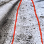 After the large snowstorm Jan. 5-6, 2023, many of the sidewalks in Centretown were not plowed as of Jan. 8. The red lines indicate where the sidewalk is. It would be difficult if not impossible for someone with a mobility device to use this street. (Jenn Doumoulin/The BUZZ)
