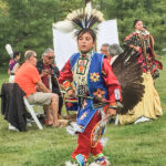 At an Indigenous-led welcoming ceremony September 29, the National Capital Commission celebrated the unveiling of the first sign with the new name for the former Sir John A. Macdonald Parkway: Kichi Zībī Mīkan (the Great River Road). Members of the public, led by four jingle dress dancers, were invited to dance in a circle to music from the Kitchissippi-Rini drum circle of four Elders. (Alayne McGregor/The BUZZ)