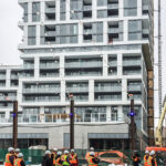 Politicians and media get dressed up in protective clothing to tour the co-living suites in the Common at Zibi building while it's still under construction. (Alayne McGregor/The BUZZ)