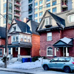The owners of these Queen Street properties, Fleming Property Management, provide five front-yard parking spaces for their tenants. Only one is permitted by the city. (Ed McKenna/The BUZZ)