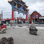 The site beside the Chinatown Royal Gateway where the new monument to Chinese Canadian workers who helped complete the Canadian Pacific Railway in the 19th century will be placed, replacing the boulders. (Brett Delmage/The BUZZ)